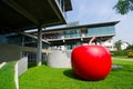 Creative design red big apple fiberglass sculpture `JohnnyAppleSex` by artist Thaweesak Srithongdee at Bangkok sculpture center. Royalty Free Stock Photo