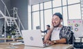 Creative designer slap face when sleepy while working hard with laptop at modern office.workplace lifesyle concept Royalty Free Stock Photo