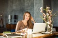 Creative Designer Woman Using Laptop and Graphics Tablet at Office Deck