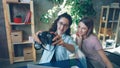 Creative designers are posing for selfie together sitting in modern office. They are using camera, laughing and Royalty Free Stock Photo