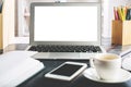 Creative desk top with white laptop screen Royalty Free Stock Photo