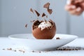 Creative dessert plating chocolate sphere cracking open to reveal mousse, a true culinary showpiece, Generated AI Royalty Free Stock Photo
