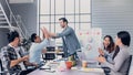 Creative director team lead clap hand with designer team at meeting table.discussion idea in creative office