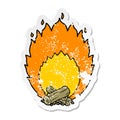 A creative distressed sticker of a cartoon blazing camp fire