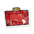 A creative distressed sticker of a cartoon briefcase Royalty Free Stock Photo