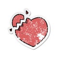 A creative distressed sticker of a cartoon broken heart Royalty Free Stock Photo