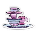 A creative distressed sticker cartoon doodle of colourful bowls and plates