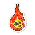 A creative distressed sticker of a cartoon fireball