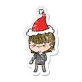 A creative distressed sticker cartoon of a girl regretting a mistake wearing santa hat