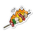 A creative distressed sticker of a cartoon kebab sticks Royalty Free Stock Photo