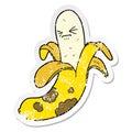 A creative distressed sticker of a cartoon rotten banana