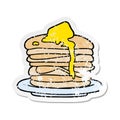 A creative distressed sticker of a cartoon stack of pancakes