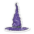 A creative distressed sticker of a cartoon witchs hat