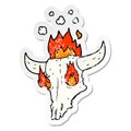 distressed sticker of a spooky flaming animals skull cartoon Royalty Free Stock Photo