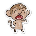 A creative distressed sticker of a yawning cartoon monkey