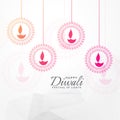 Creative diwali festival greeting card design with hanging diya