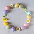 Creative Easter layout made of colorful eggs and flowers Royalty Free Stock Photo