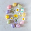 Creative Easter layout made of colorful eggs and flowers Royalty Free Stock Photo