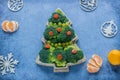 Creative edible Christmas tree made of fresh broccoli.Holiday ideas. New year food background top view . holiday, celebration,