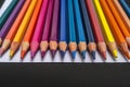 Creative essentials Array of colored pencils and paper on black