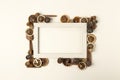 Creative Fall mock up frame made with dried lemons, pine cones and vanilla sticks on pastel background