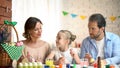 Creative family decorating eggs for Easter, perfect time, traditions and values Royalty Free Stock Photo