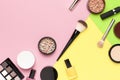 Creative Fashion background. Set of decorative cosmetics mascara powder lipstick eyeshadow blush makeup brush on colorful Royalty Free Stock Photo