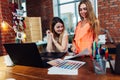 Creative female interior decorator working with a customer in her office choosing colors for a new design using color Royalty Free Stock Photo