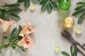 Creative female table with candles, scissors and flower. Top view with copy space.