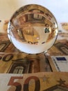 Creative finance concept, crystal ball & banknotes