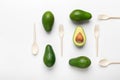 Creative flat lay of avocados and biodegradable Single-Use Cutlery