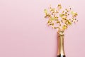 Creative flat lay composition with bottle of champagne and space for text on color background. Champagne bottle with Royalty Free Stock Photo