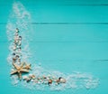 Creative flat lay concept of summer travel vacations. Top view of seashells and starfish on turquoise blue background. Royalty Free Stock Photo