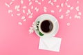 Flat lay of coffee, letter mockup and white petals Royalty Free Stock Photo