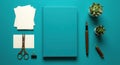 Creative flat lay desk setup with notebook pens scissors and plants for productivity Royalty Free Stock Photo