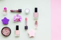 Creative flat lay of fashion bright nail polishes and decorative cosmetic on a colorful background. Minimal style. Copy space. Royalty Free Stock Photo