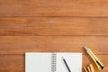 Creative flat lay photo of workspace desk. Office desk wooden table background with open mock up notebooks and pens and plant. Royalty Free Stock Photo