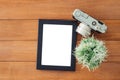 Creative flat lay photo of workspace desk. Office desk wooden table with old camera and poster mockup template. Royalty Free Stock Photo