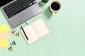 Creative flat lay photo of workspace desk. Top view office desk with laptop, coffee cup and open mockup black notebook on pastel Royalty Free Stock Photo