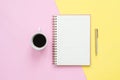 Creative flat lay photo of workspace desk. Top view office desk with mock up notebooks, plant, coffee cup and copy space on pastel Royalty Free Stock Photo