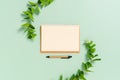 Creative flat lay photo of workspace desk. Top view office desk with open mockup blank notebooks and pencil and plant on pastel Royalty Free Stock Photo