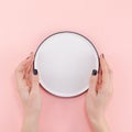 Empty plate in female hands mockup Royalty Free Stock Photo