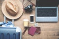 Creative flat lay Travel concept. Laptop computer on table with traveler`s items Royalty Free Stock Photo