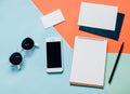 Creative flat lay of workspace desk with smartphone