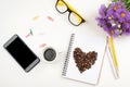 Creative flatlay with open book, mobile phone, glasses, coffee and summer flowers on white table. Top view, copy space. Woman Royalty Free Stock Photo