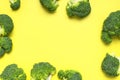 Creative food concept. Frame made of Fresh raw green broccoli on yellow background. Healthy vegetables, diet vegan organic food, Royalty Free Stock Photo