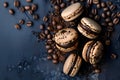 Brown Macaroon Macaron with coffee beans and cocoa powder scattered on dark concrete background