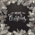 Creative frame made of silver Christmas fir branches. Silver Merry Christmas text on dark background Royalty Free Stock Photo