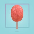 Creative funny  idea made from a stick of ice cream and the human brain with frame on a blue background Royalty Free Stock Photo