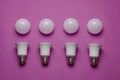 Creative geometric composition with LED bulbs and white spheres on a pink background Royalty Free Stock Photo